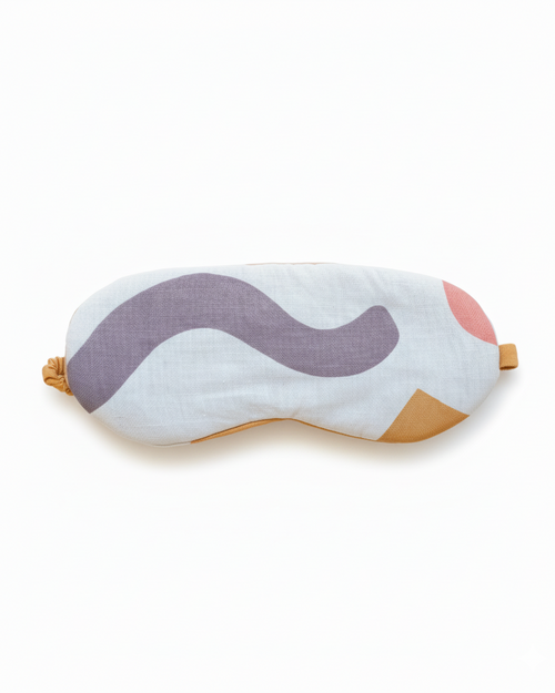 Sleep mask with wavy abstract design on a white background