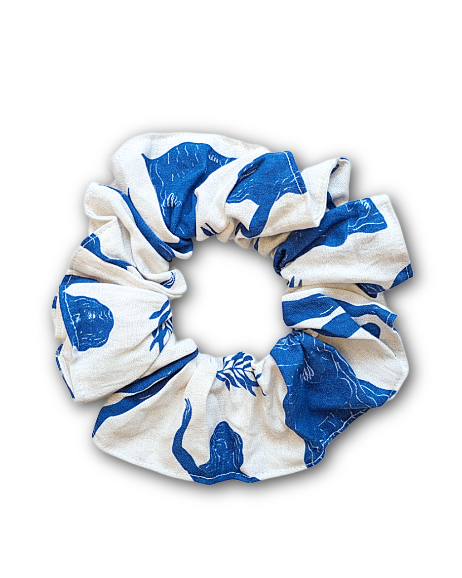 blue and white line drawing of female body and moon print srunchie