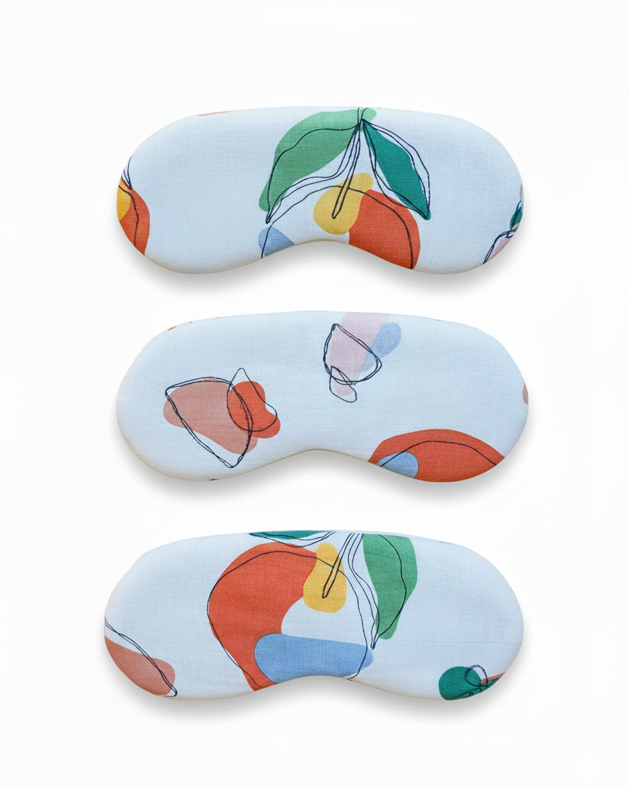 cotton eye mask with colourful abstract art fruit print on a white background